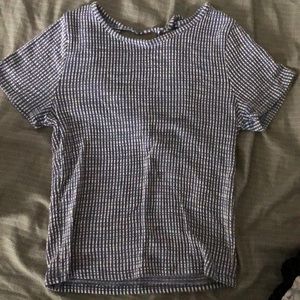 Caution to the wind, tight-fitted, short sleeve shirt.